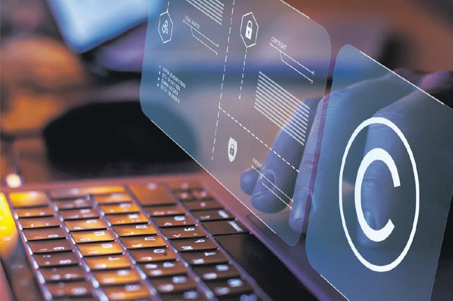 Person using keyboard with modern screen, computer security concept.