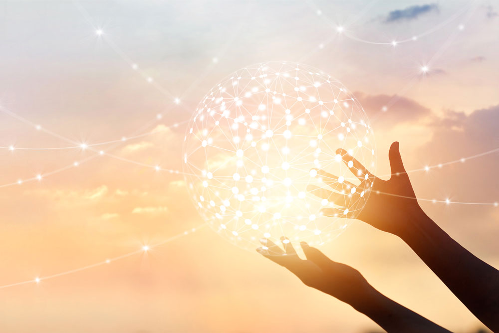 Abstract concept, global network connection in hands on sunset background.